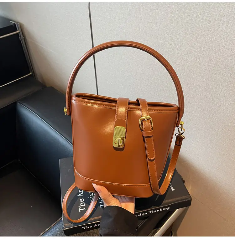 Women's Brown Leather Bucket Bag with Gold Plated Clasp — feature 24