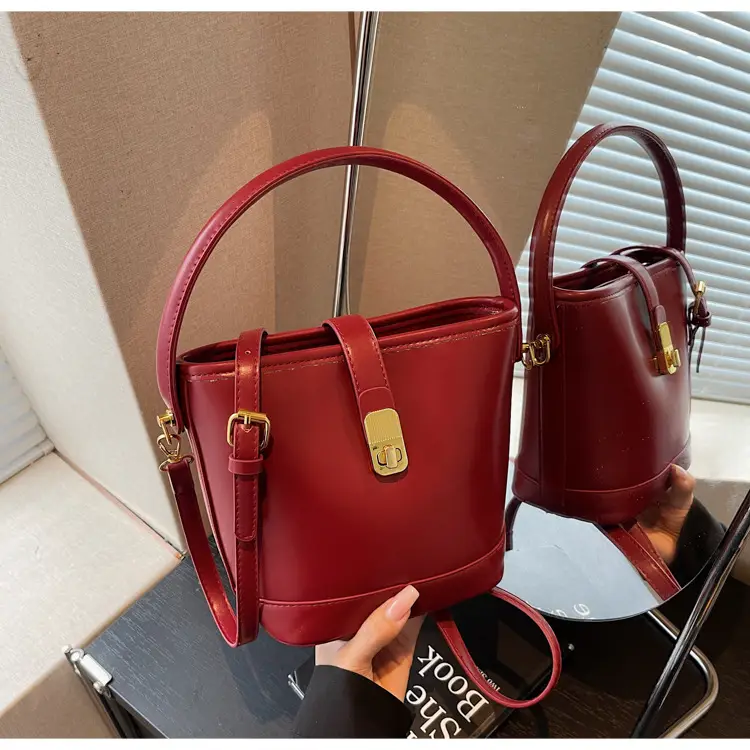 Women's Brown Leather Bucket Bag with Gold Plated Clasp — feature 34