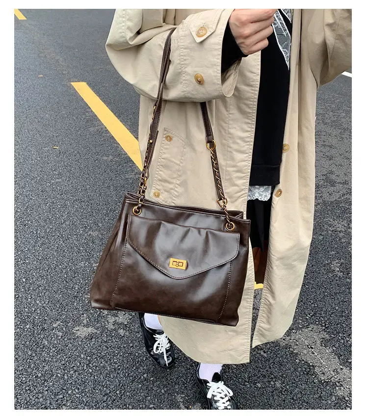 Black Leather Shoulder Bag with Gold Chain — feature 11