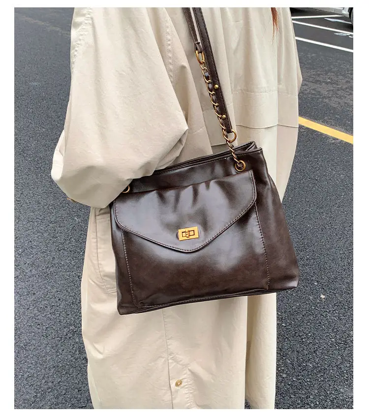 Black Leather Shoulder Bag with Gold Chain — feature 12