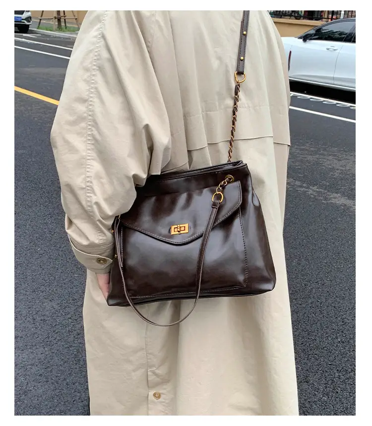 Black Leather Shoulder Bag with Gold Chain — feature 14