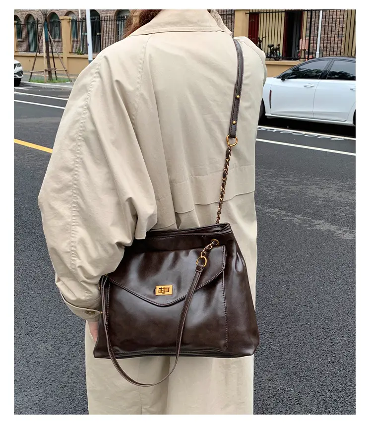 Black Leather Shoulder Bag with Gold Chain — feature 16