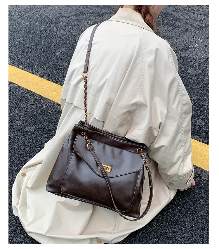 Black Leather Shoulder Bag with Gold Chain — feature 17