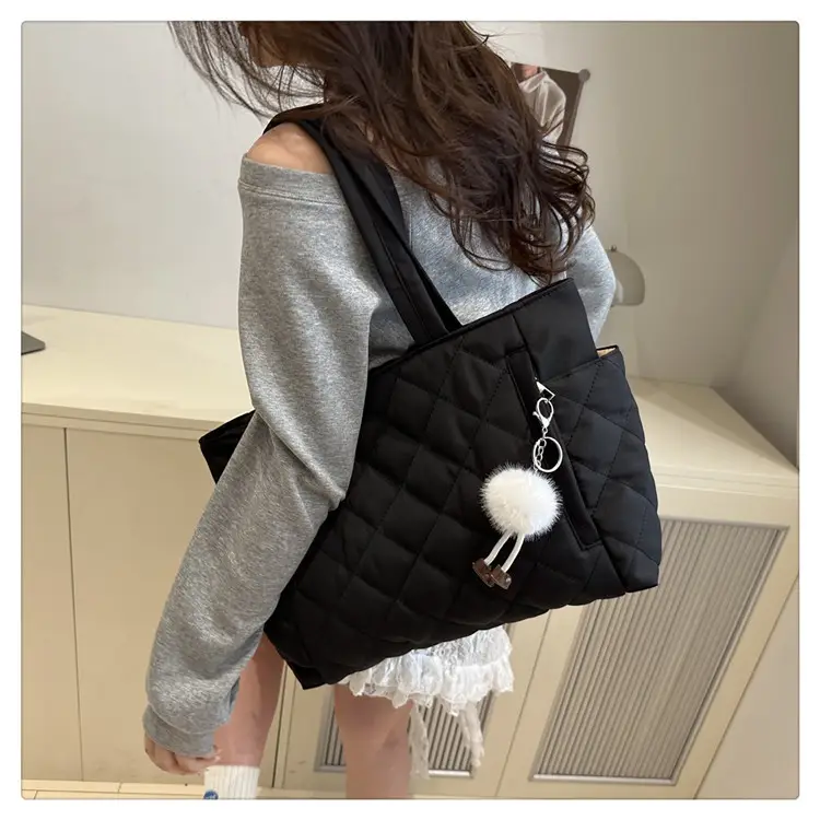 Black Quilted Women's Shoulder Bag with Pom Pom Charm — feature 21