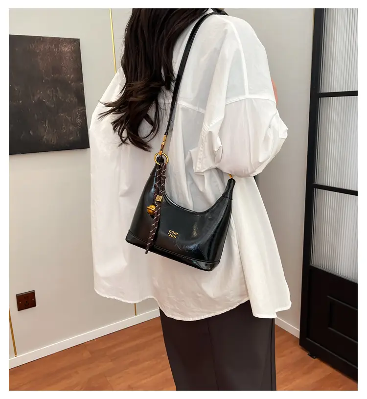 Black Leather Shoulder Bag with Gold Plated Handles — feature 1