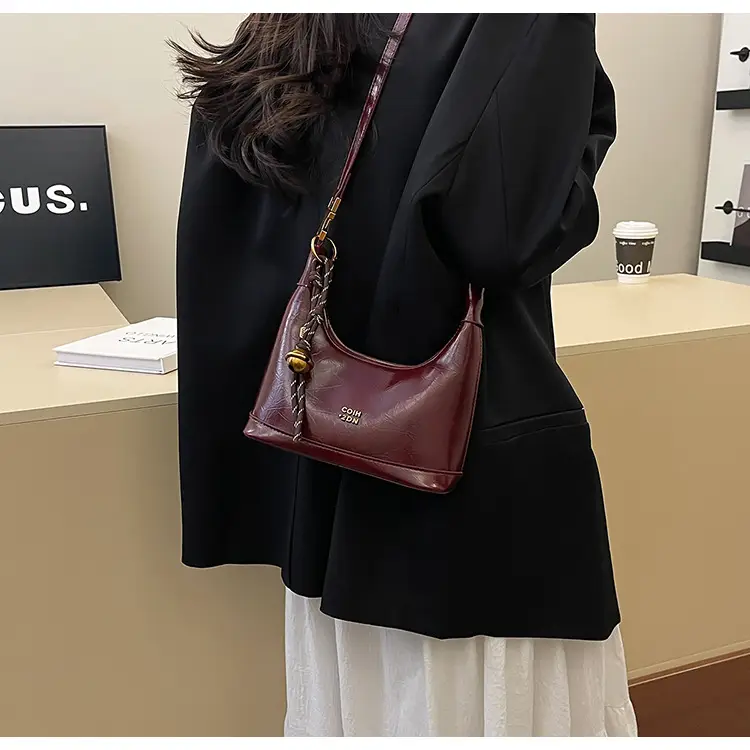 Black Leather Shoulder Bag with Gold Plated Handles — feature 11