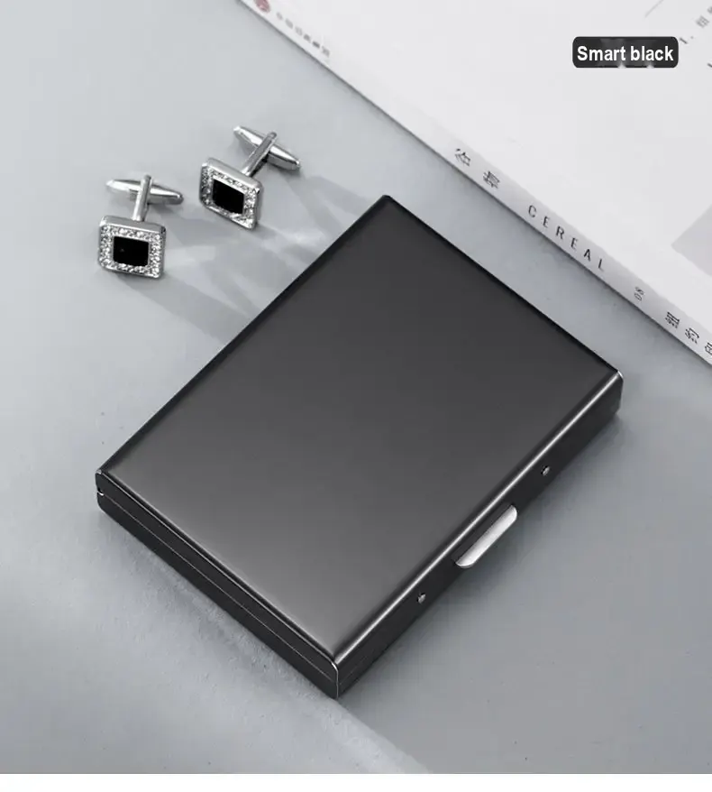Closed dark card holder beside cufflinks