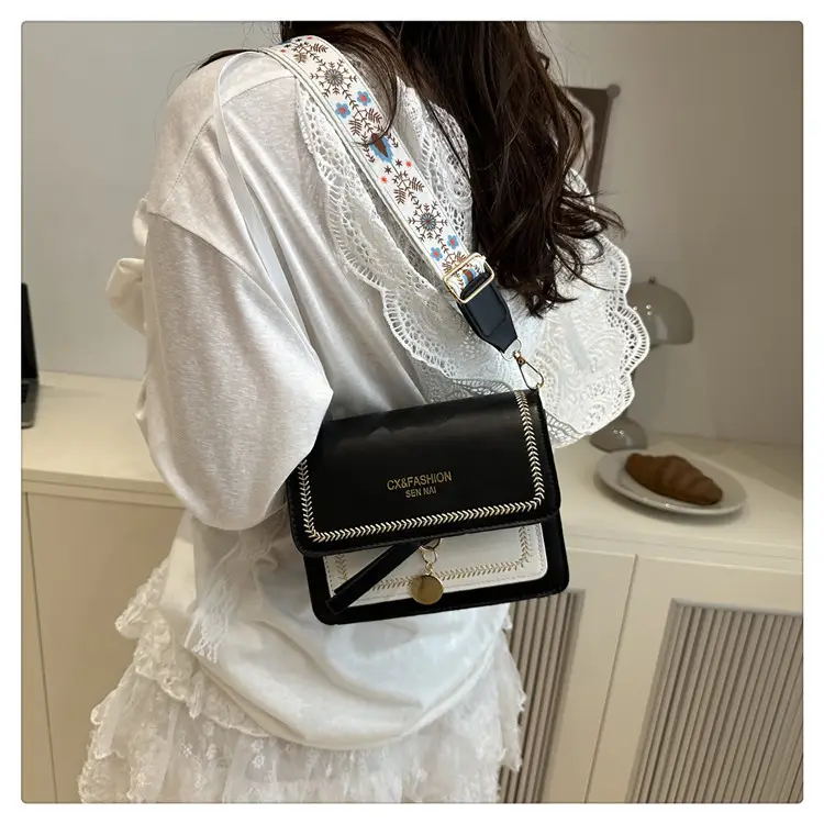 Minimalist Crossbody Bag with Wide Strap & Textured Strap — feature 17