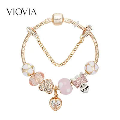 Gold Toned Bracelet with Peach Hearts & Diamond Accents