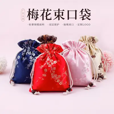 Red Drawstring Jewelry Bag with Embroidered Design