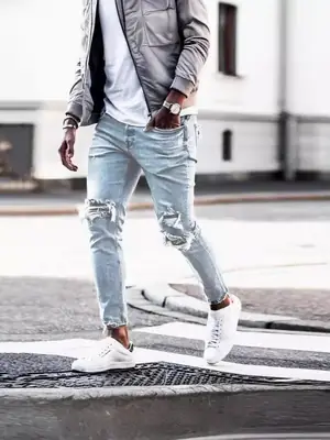 Washed Light Blue Jeans for Men with Holes & White Sneakers