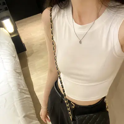 Black Sleeveless Top with Gold Necklace & Black Handbag