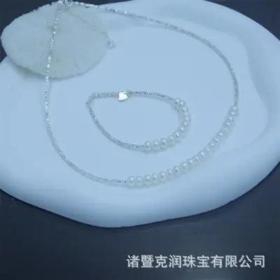 Broken Silver Pearl Necklace with Heart Design
