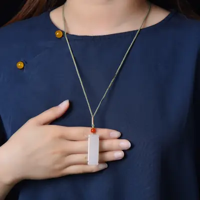 White Jade Pendant with Red Opal Accents