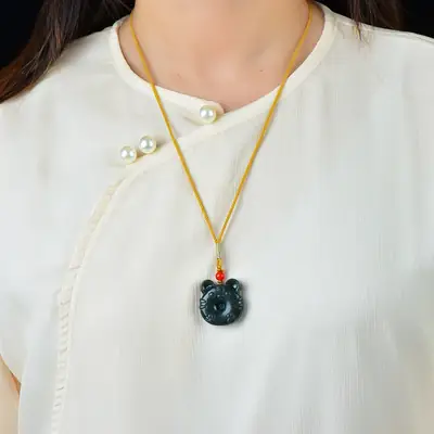 Hetian Jade "Meng Meng Tiger" Pendant with Red Bead