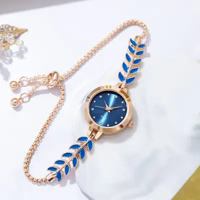 Women's Blue Dial Bracelet Watch with Green Gemstone