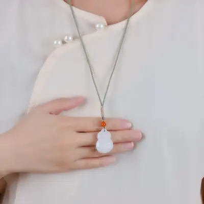 White Jade Bear Pendant with Red Stone