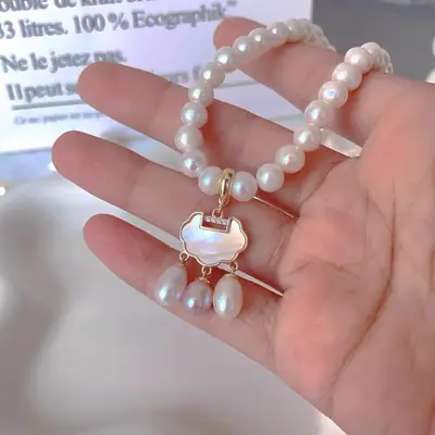 14K Gold Pearl Peace Lock Pendant for Women