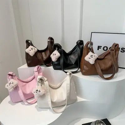 Women's Soft Leather Crossbody Bag with Cute Pom Pom Design