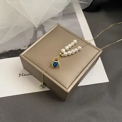Women's Pearl Necklace with Blue Crystal Pendant