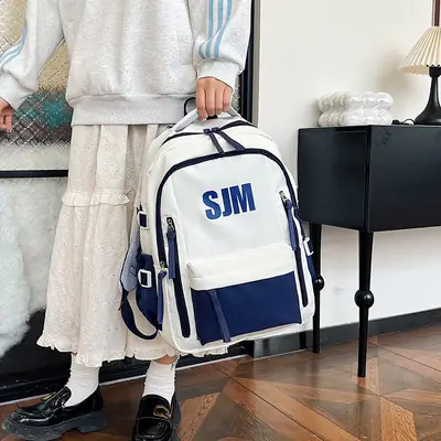 Blue White Student Backpack with "SIM" Print