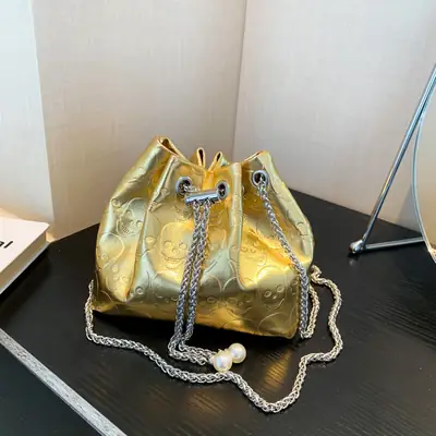 Golden Drawstring Bucket Bag with Chain Crossbody Strap