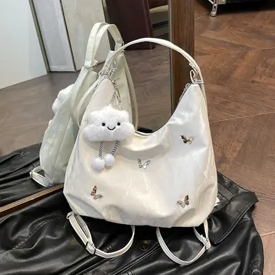 Silver Butterfly Shoulder Bag with Pom Pom Charm