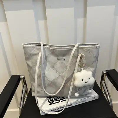 Women's Silver Quilted Shoulder Bag with Cute Pom Pom Design