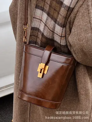 Black Leather Shoulder Bag with Gold Hardware