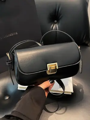 Women's Black Saddle Crossbody Bag with Gold Clasp