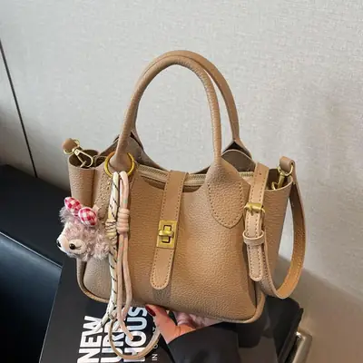Women's Tan Leather Shoulder Bag with Tassel & Handle