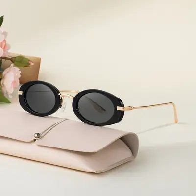 Women's Black Oval Sunglasses with Gold Frame