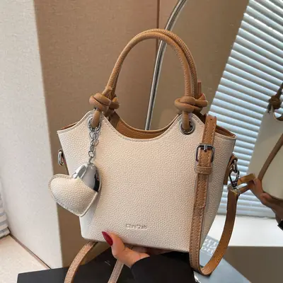 Women's Textured Crossbody Bag with Heart Charm