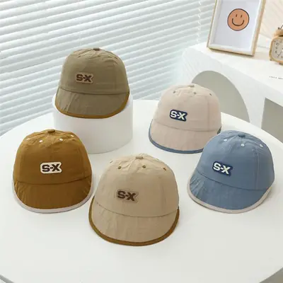 Baby Duck Cap with "SX" Logo Beige Soft Brim Hat