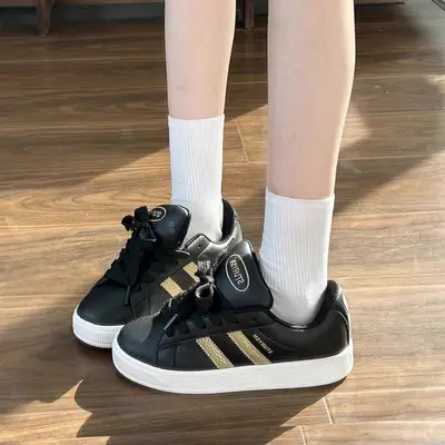 Treasure Girl Women's Black Sneakers with Gold Stripes