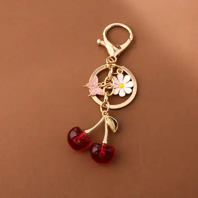 Gold Flower Pendant with Cherry & Butterfly Design
