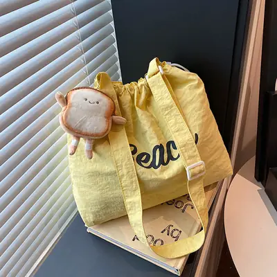 Women's Yellow Printed Tote Bag with Cute Doll