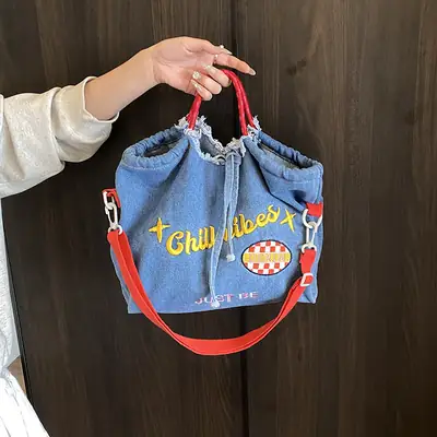 Blue Denim Shoulder Bag with "T Girl Robber" Design