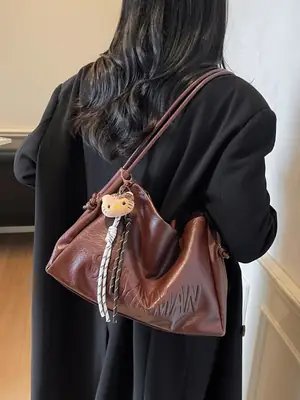 Stylish Brown Crossbody Bag with Cute Charm